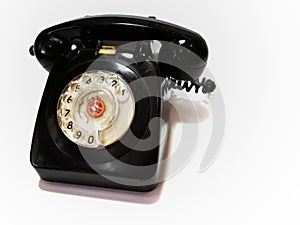 A vintage and antique telephone with white background. photo